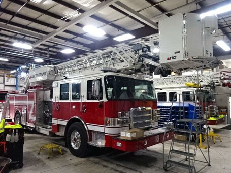 very large parked fire truck with bucket