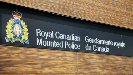sign reading Royal Canadian Mounted Police in english and french